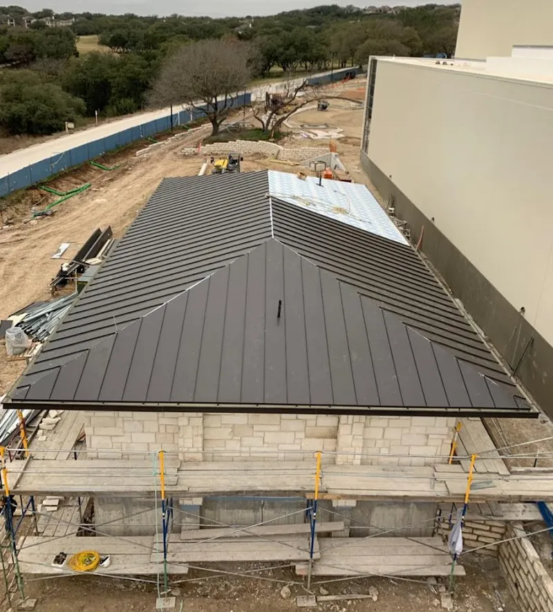 Metal roof new construction with scaffolding in Old Bridge
