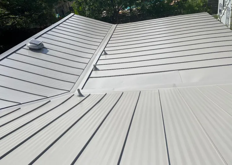 Solar attic fan installed on a metal roof for Roof Ventilation in Old Bridge